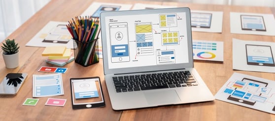 Digital and paper wireframe designs for web or mobile app.