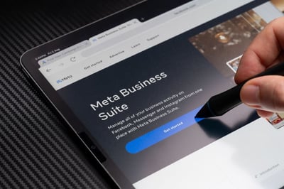 User tapping on Meta Business Suite interface, illustrating what is meta for business in social media management.